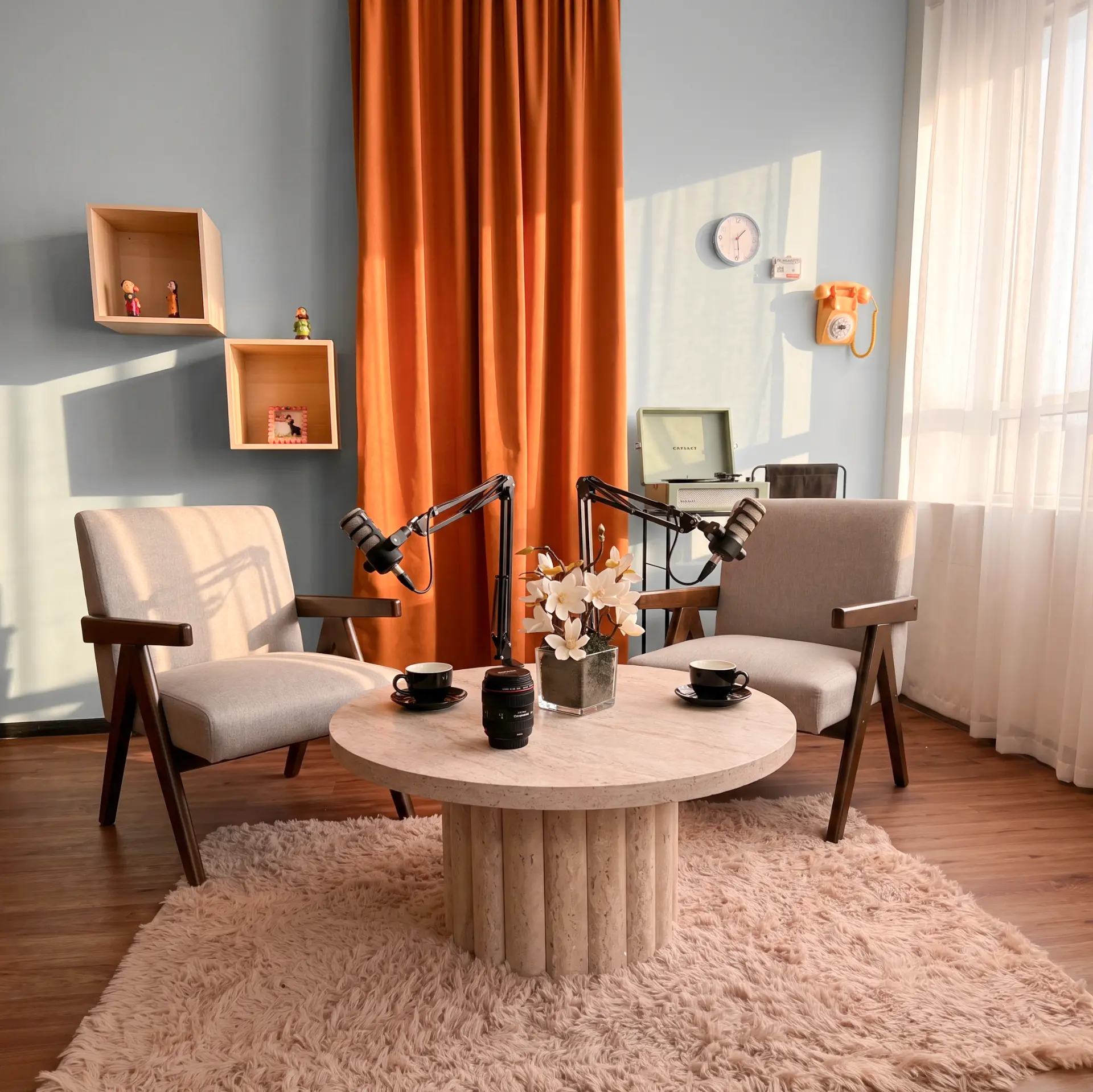 Acoustically treated podcast recording studio with broadcast microphones